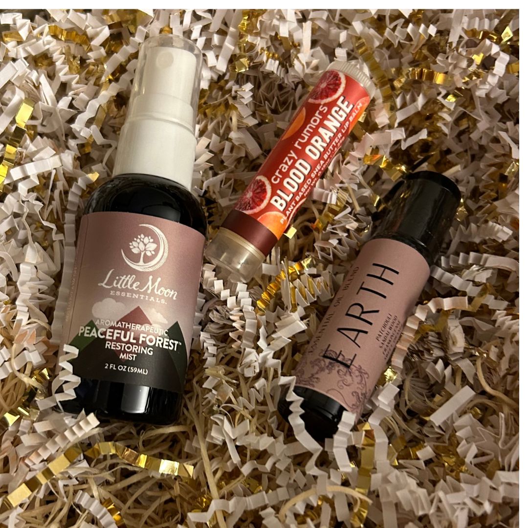 Peaceful Forest Restoring Mist 2oz with a Lip Balm and Earth Roll On Blend inside a Scent of the Month Aromatherapy Essential Oil Subscription Box