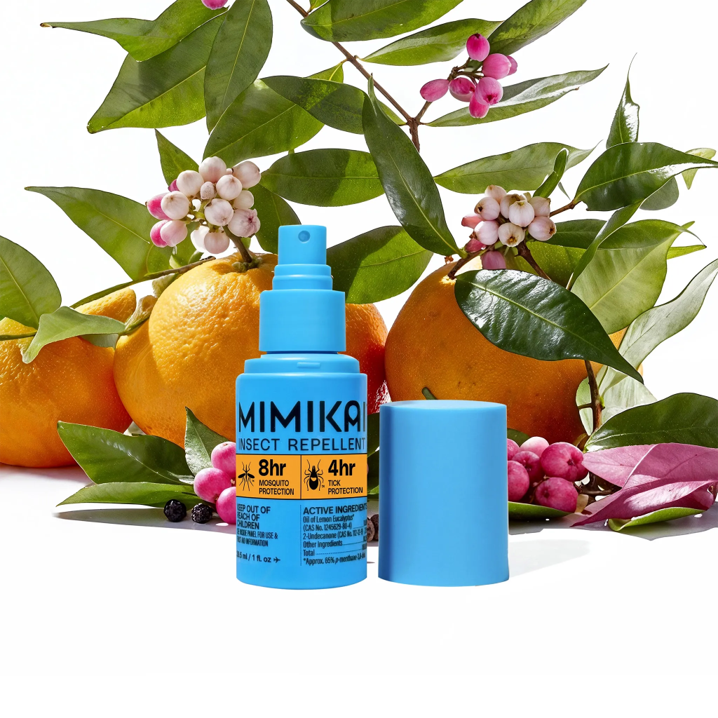 8 hour mosquito protection natural insect repellent blue spray bottle on a white background with green leaves and oranges.