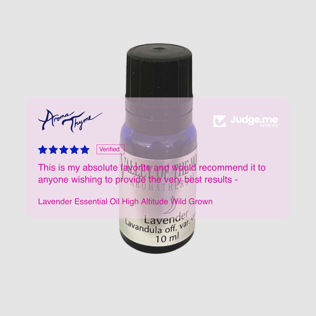 Lavender essential oil bottle with Aroma Thyme branding on a light gray background